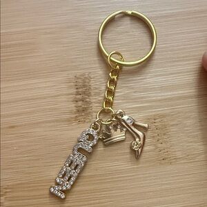 Luxurious Gold Keychain with Queen Charms
